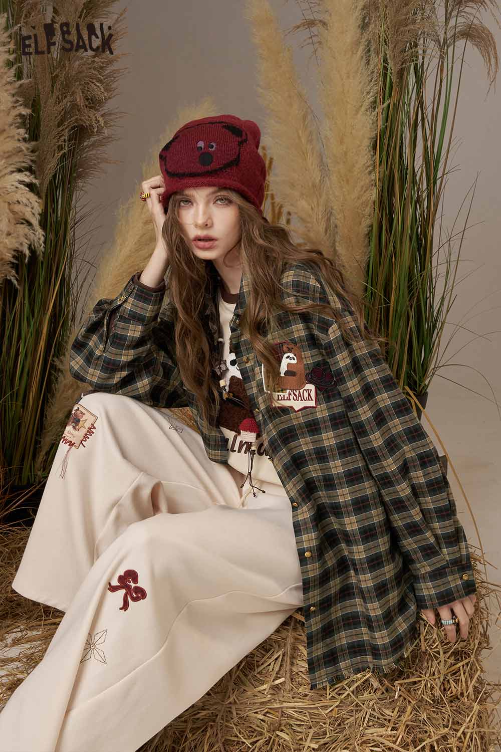 ELFSACK women's bear embroidery plaid shirt featured on a model with stylish pants and accessories