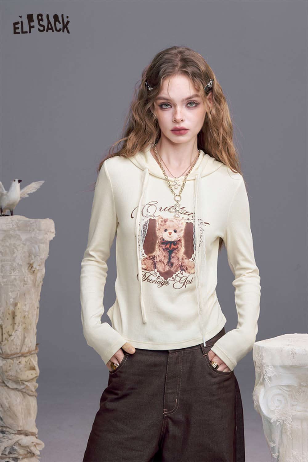 ELFSACK women's bear graphic hoodie in cream with an artistic bear design and front pouch pocket