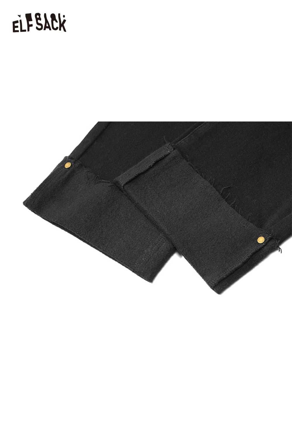 Close-up of ELFSACK women's black denim straight leg pants showcasing raw hem details and gold buttons