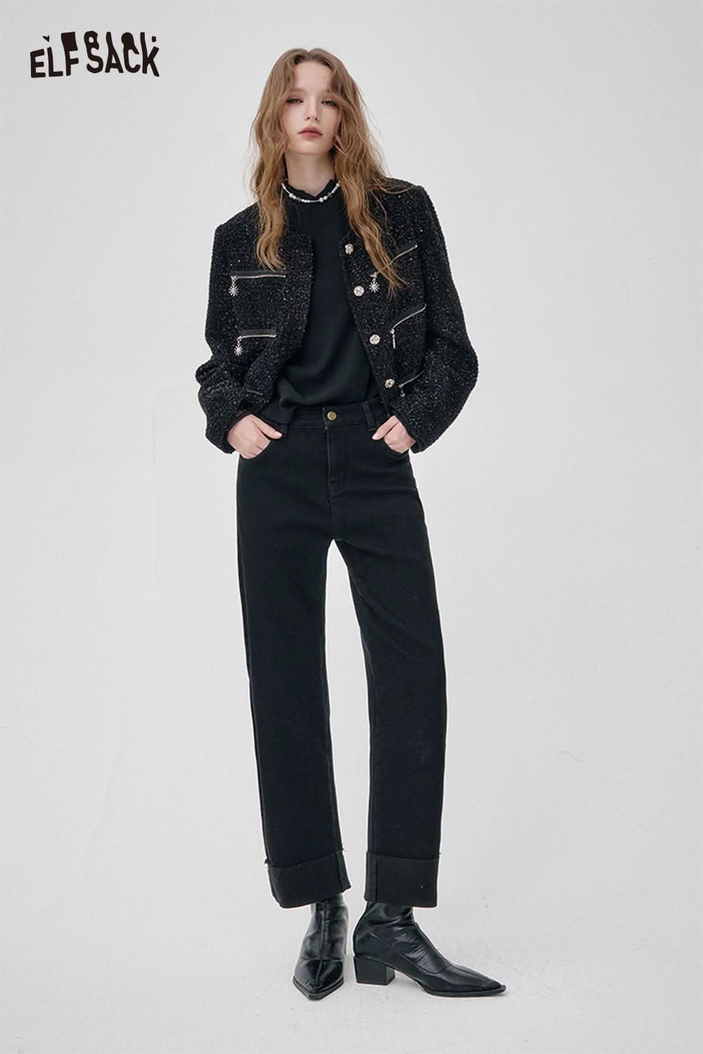 Model wearing ELFSACK women's black denim straight leg pants paired with a stylish jacket and ankle boots