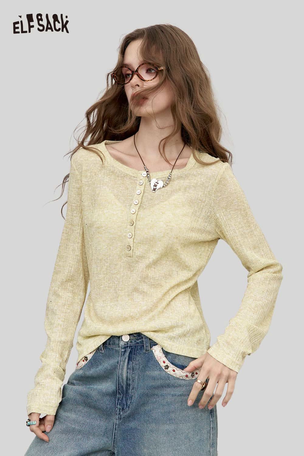 ELFSACK women's brushed jersey baselayer in soft yellow with button detail and relaxed fit