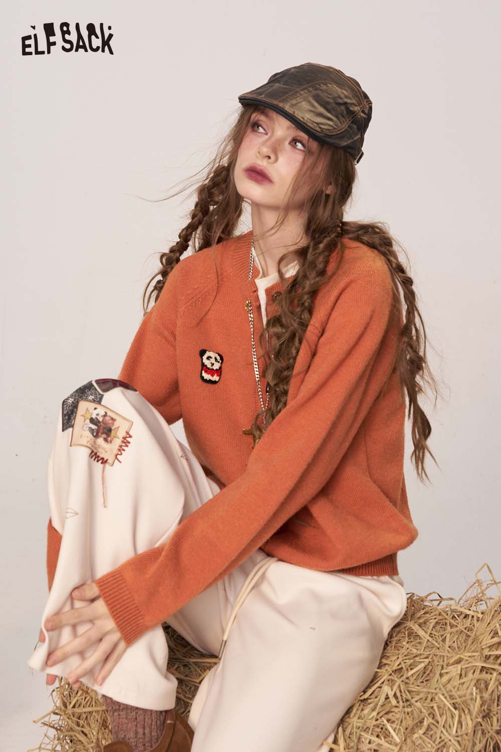 ELFSACK women's cartoon embroidery knit cardigan in orange worn with casual pants for a trendy look