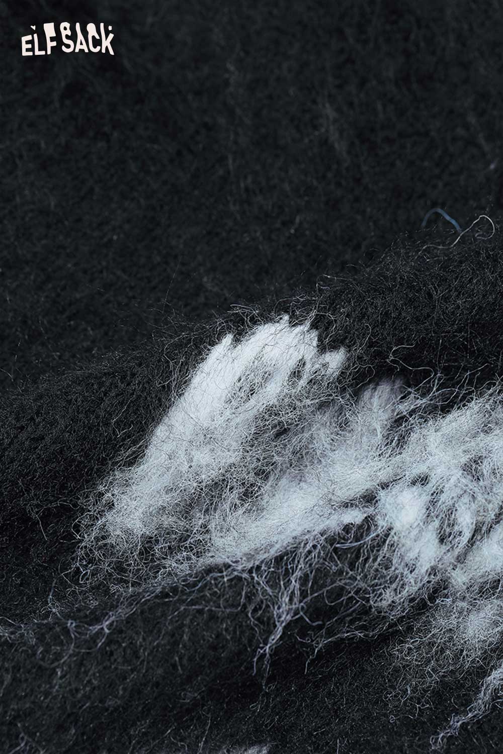 Close-up of ELFSACK women's casual cross graphic sweater featuring soft black fabric with white design