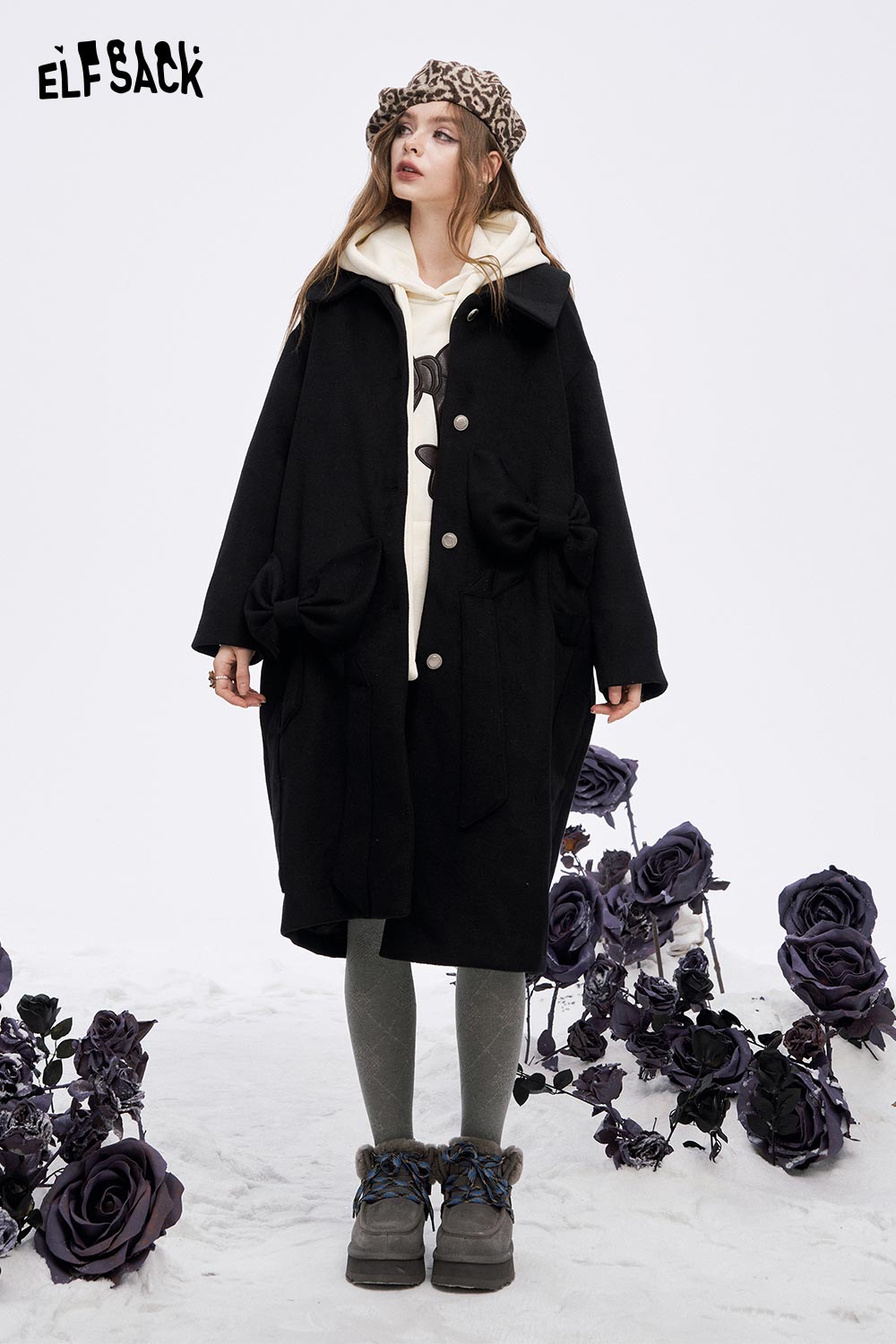 ELFSACK women's casual graphic hoodie layered under a stylish black coat with bow details