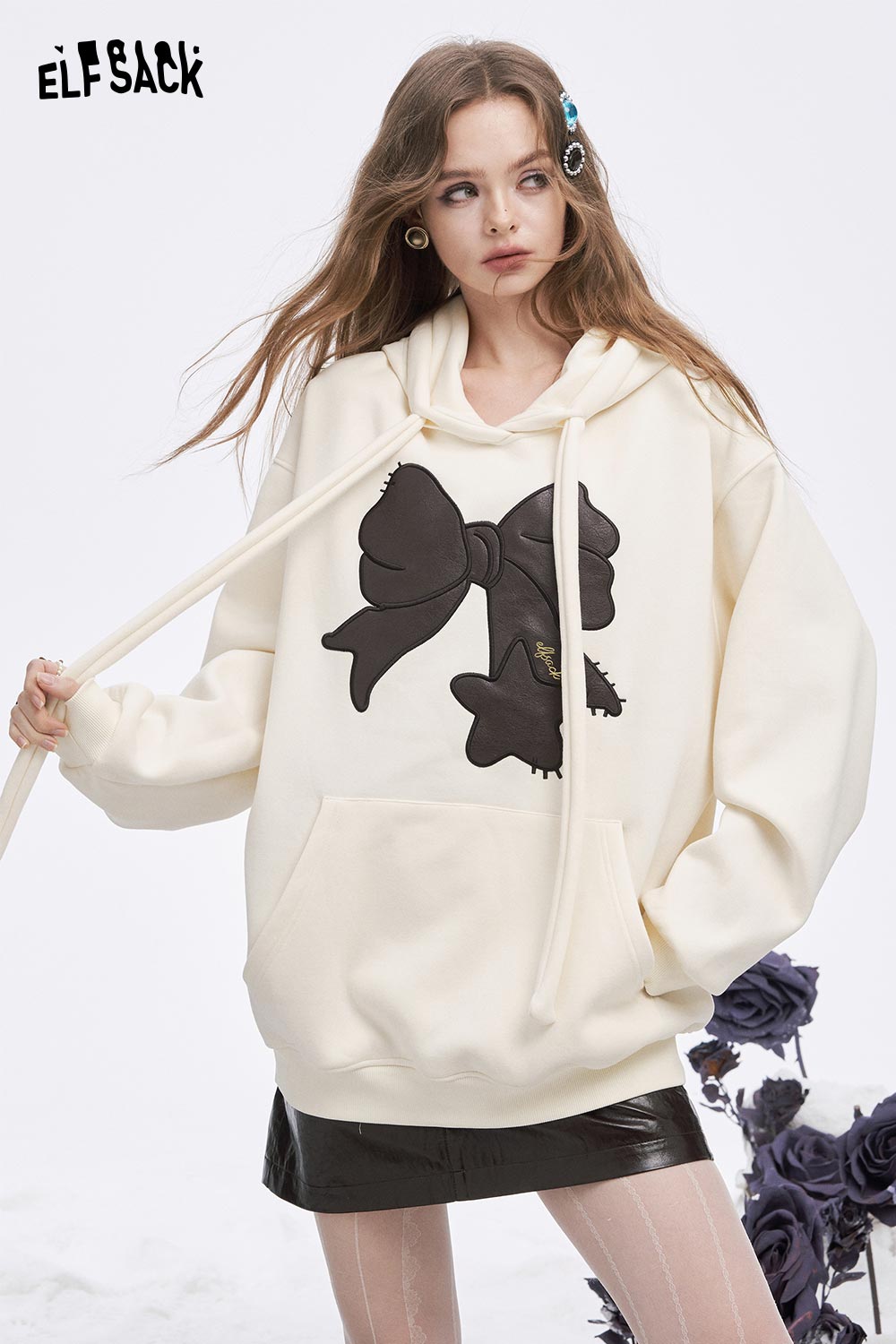 ELFSACK women's casual graphic hoodie in cream with a stylish bow design, perfect for relaxed outfits