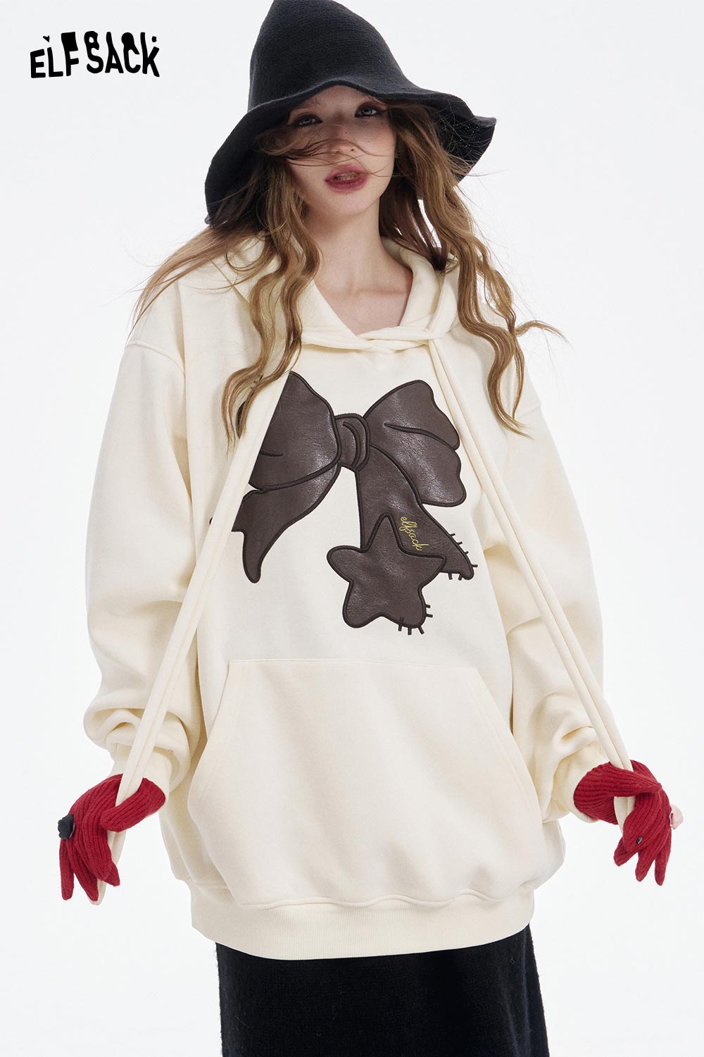 ELFSACK women's casual graphic hoodie in cream featuring a large bow design and stylish oversized fit
