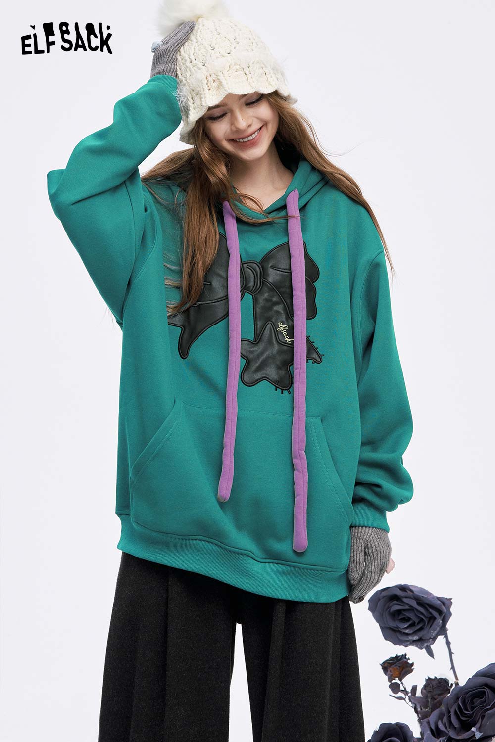 ELFSACK women's casual graphic hoodie in teal with unique design and purple drawstrings