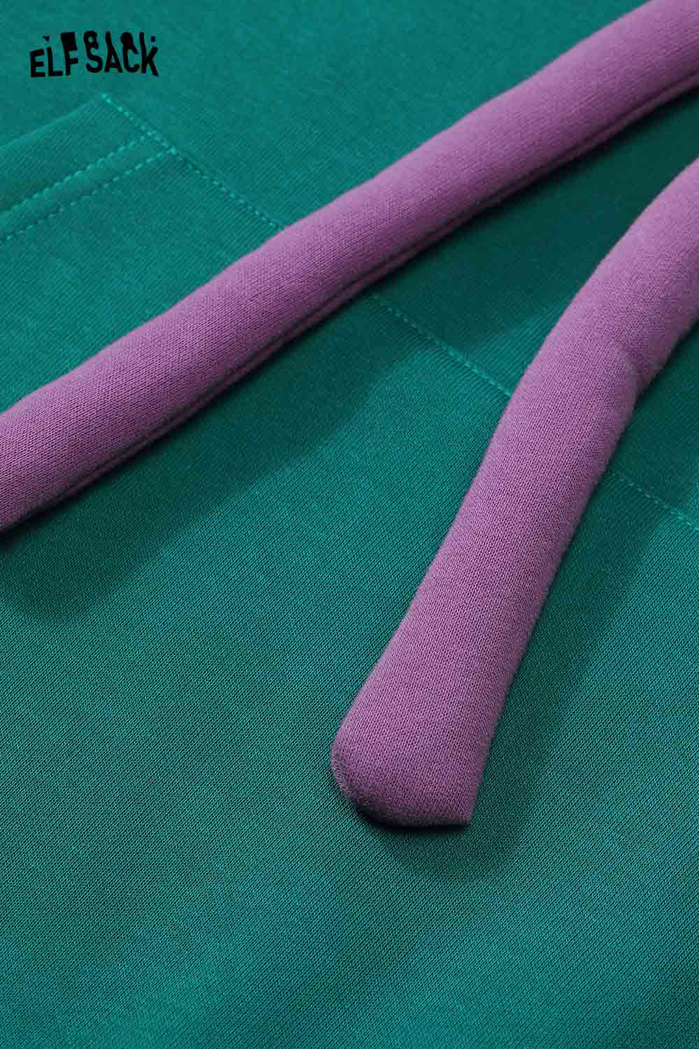Close-up of ELFSACK women's casual graphic hoodie with a vibrant green and purple design
