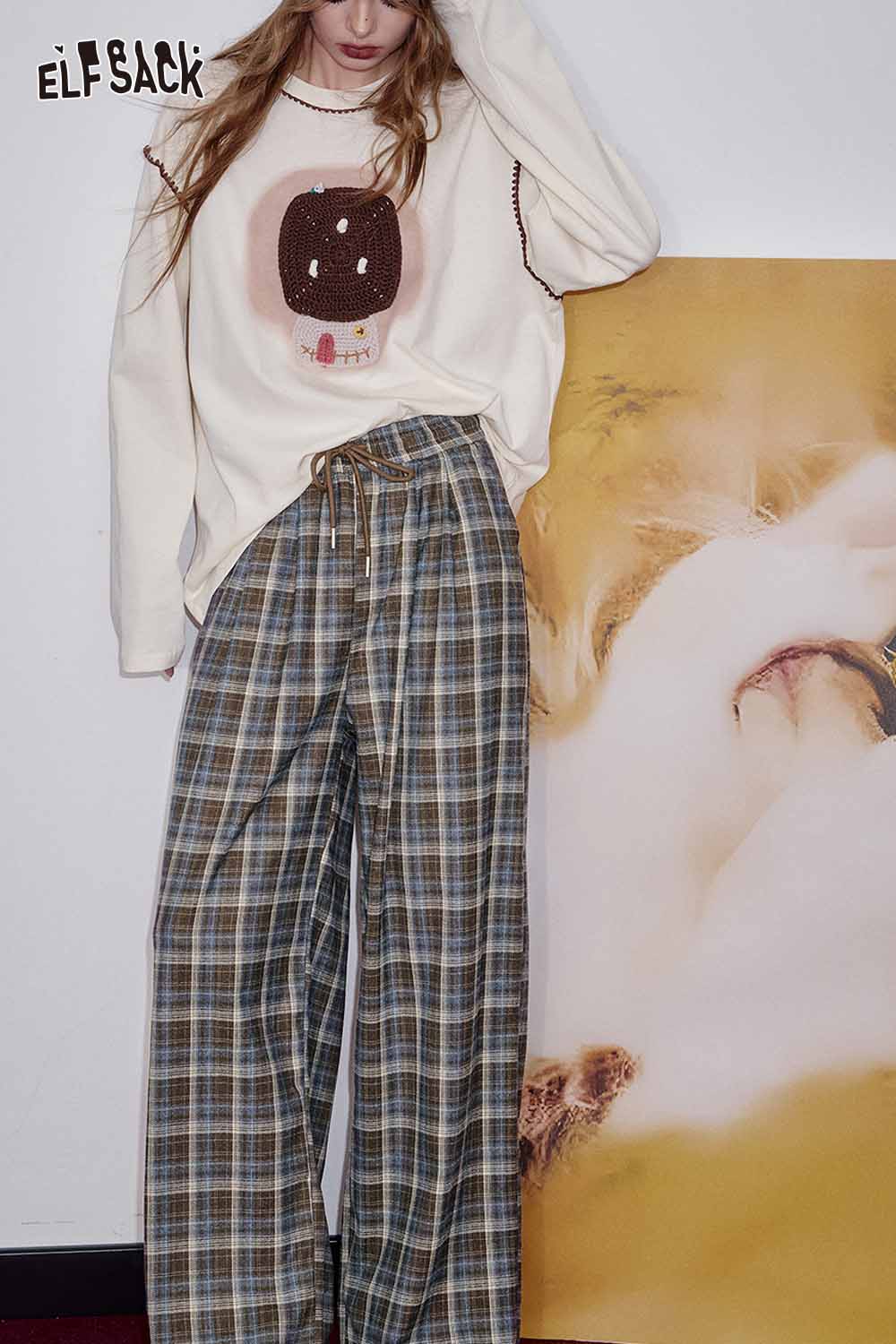 ELFSACK women's check pattern relaxed fit trousers paired with a cozy sweater for casual style