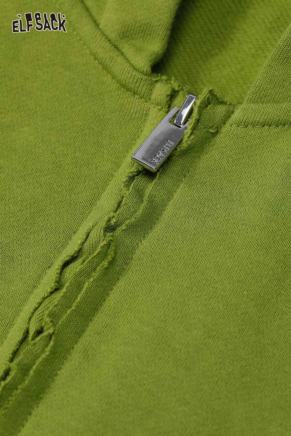 Close-up of ELFSACK women's colorful hooded jacket zipper detail in vibrant green fabric