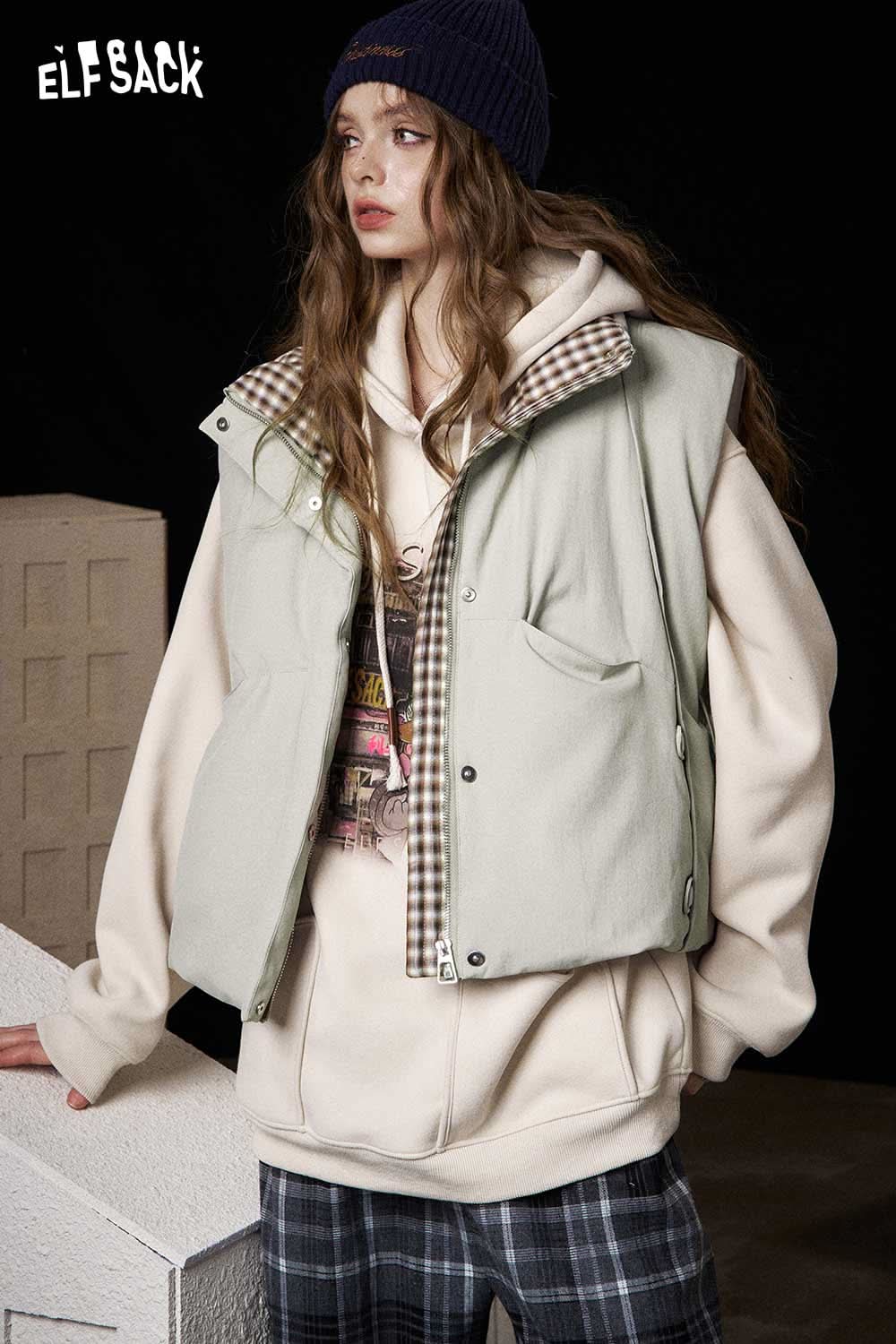 ELFSACK women's cotton blend down vest in green layered over a gray hoodie for casual style