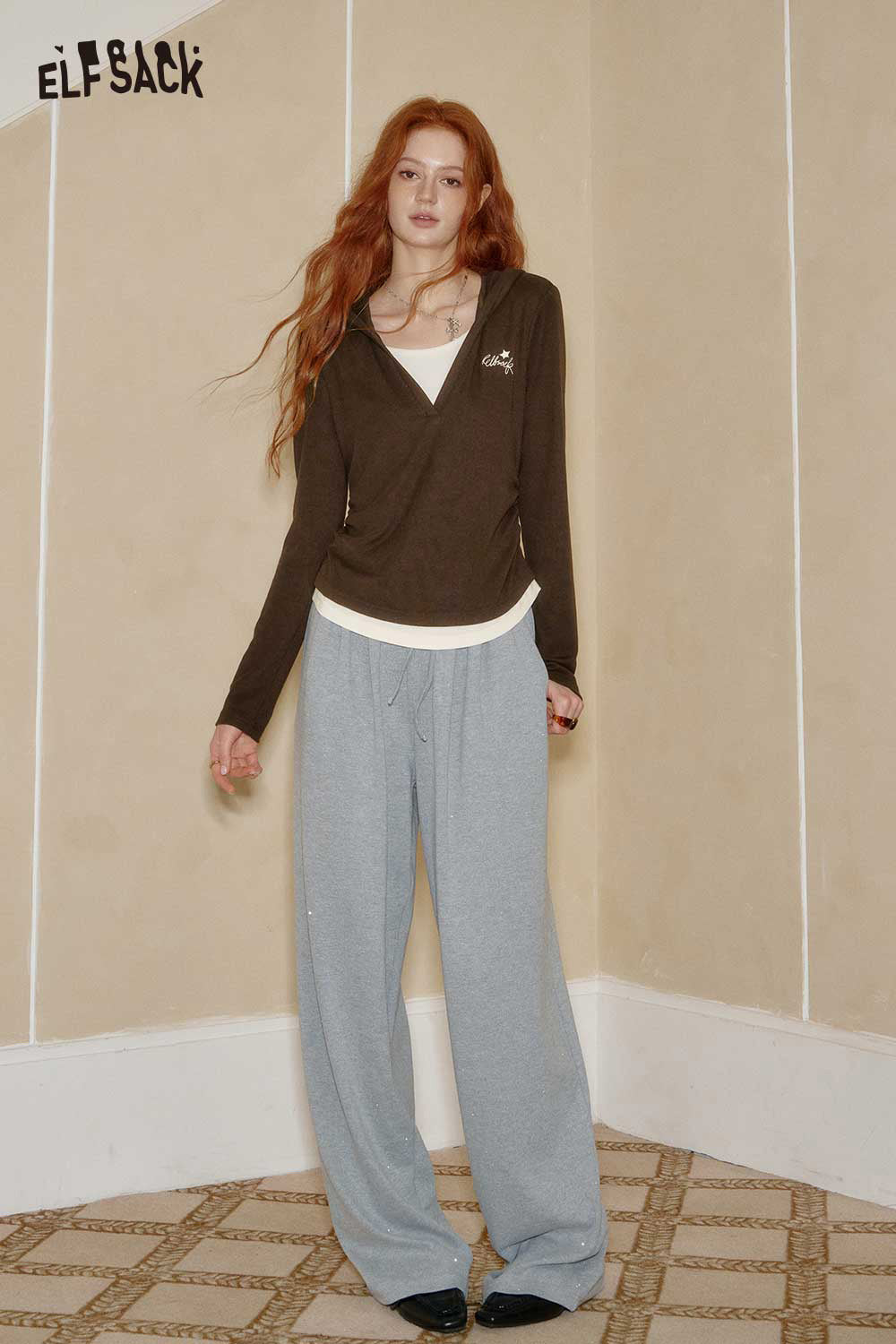 ELFSACK womens cotton blend knit top in brown, styled with relaxed grey pants for a casual look