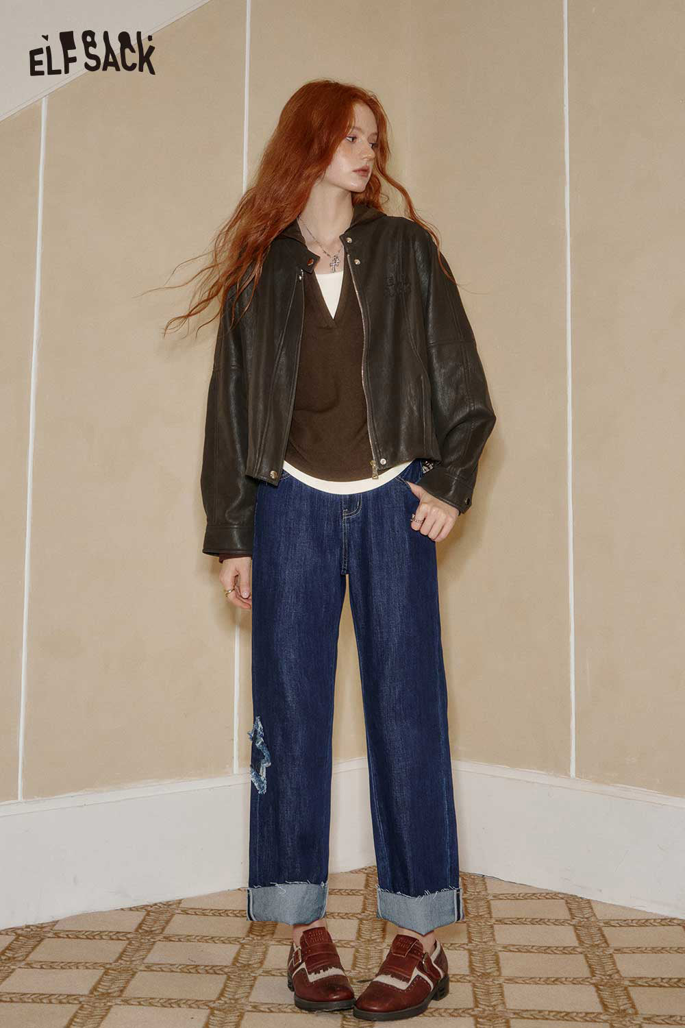 ELFSACK womens cotton blend knit top styled with a leather jacket and denim jeans for a trendy look