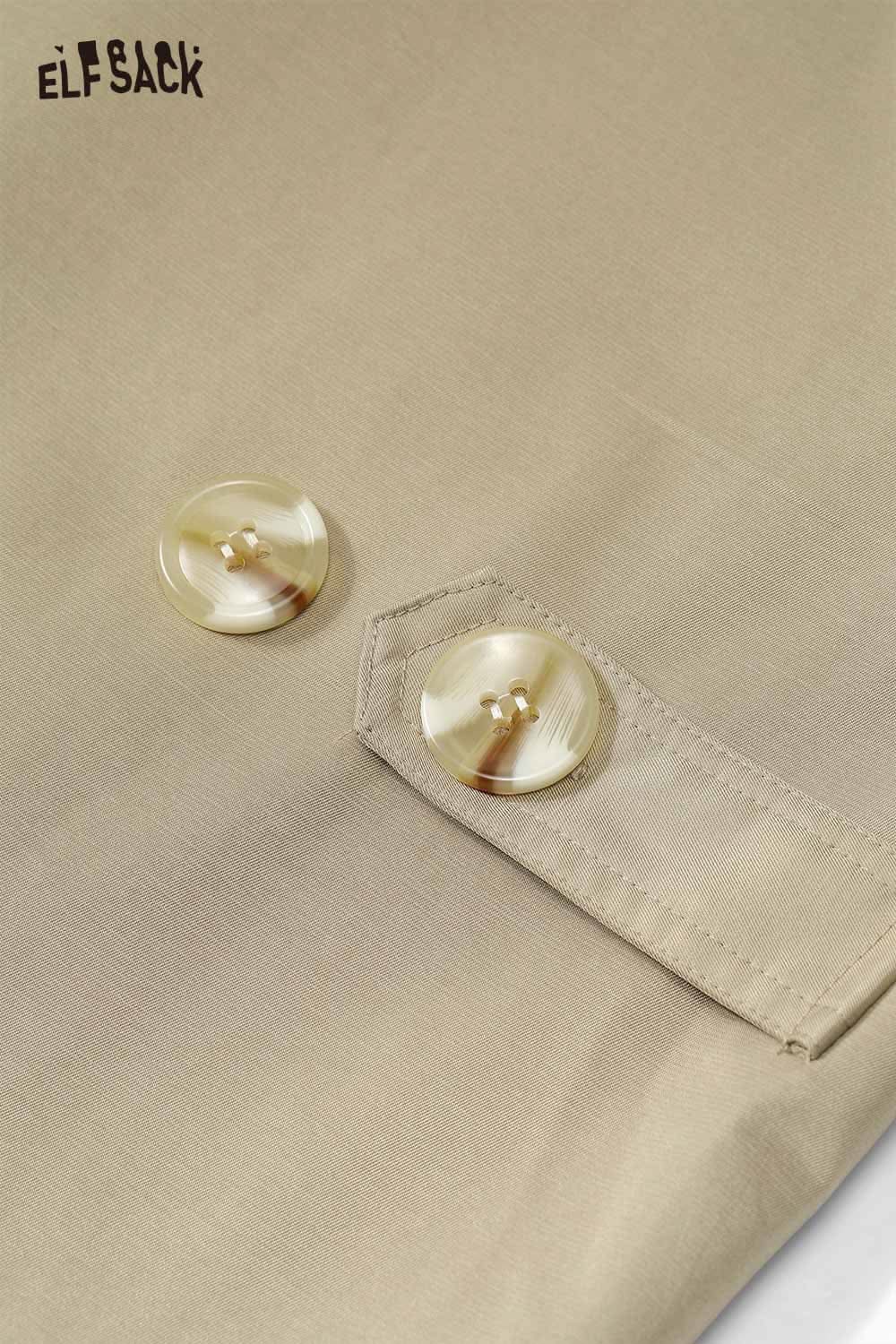 Close-up of ELFSACK women's cotton blend trench coat featuring stylish buttons and quality fabric