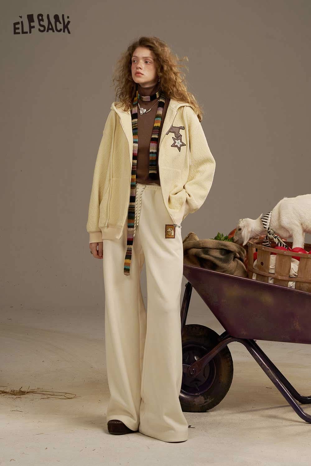 ELFSACK women's cozy turtleneck sweater paired with cream wide-leg pants for a stylish look