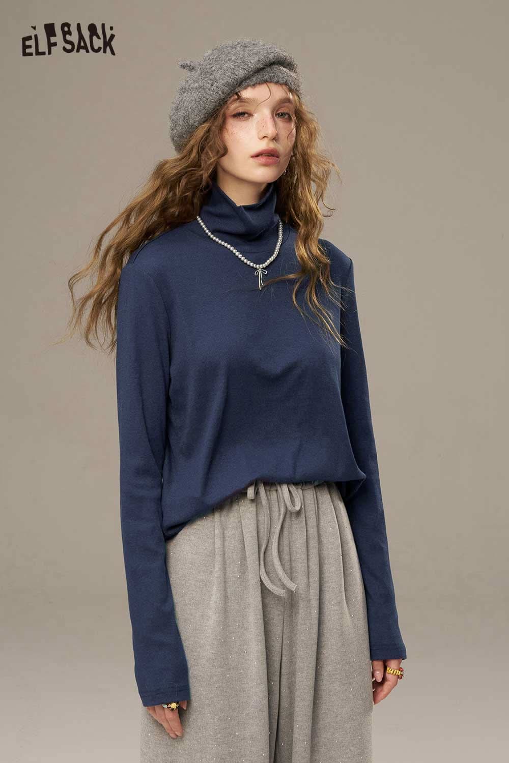 ELFSACK women's cozy turtleneck sweater in navy paired with casual gray pants for a relaxed style