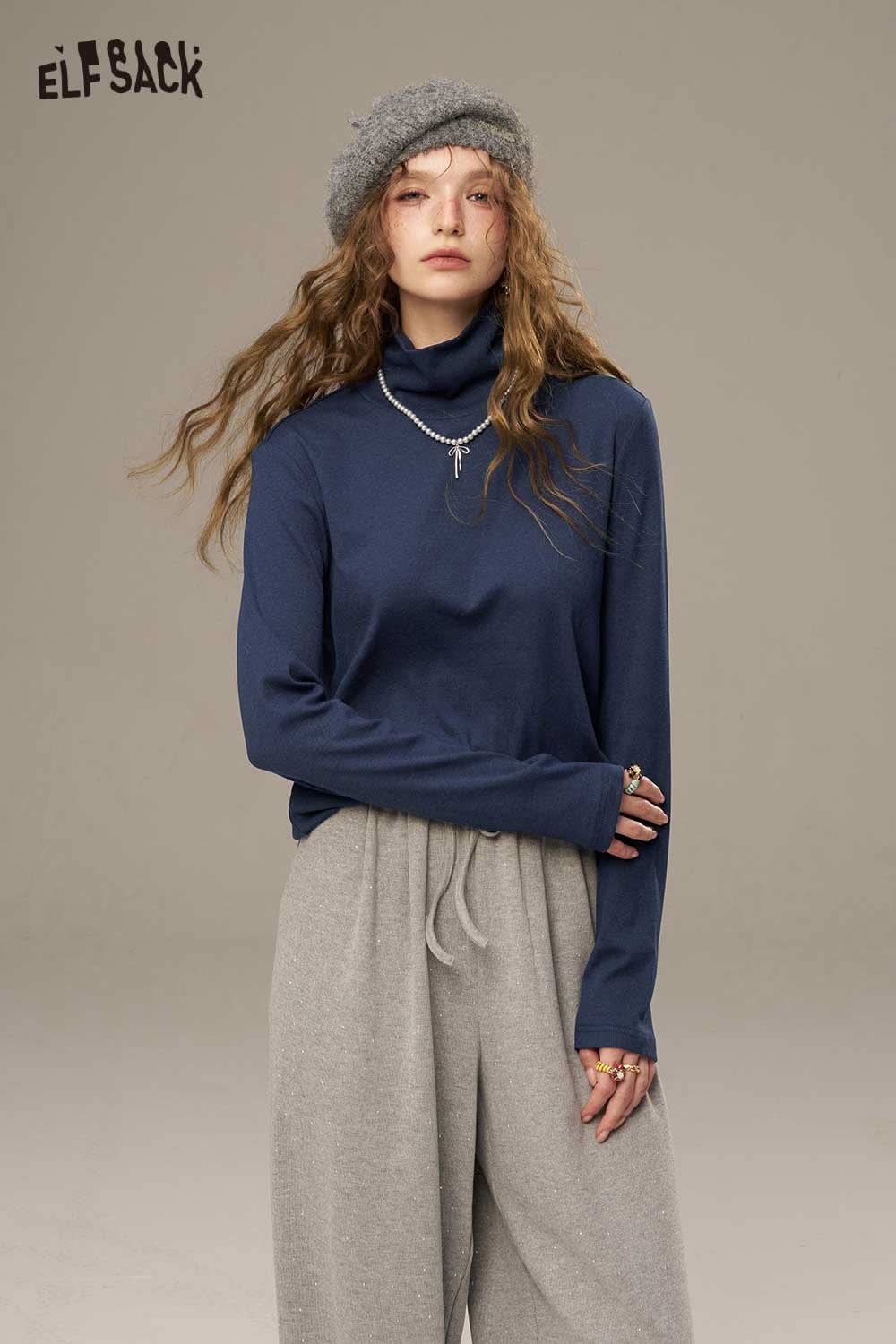 ELFSACK women's cozy turtleneck sweater in navy color paired with casual gray pants for a stylish look