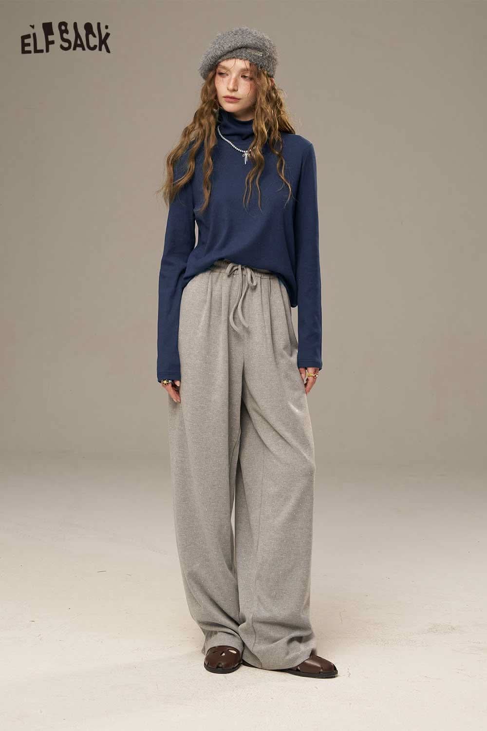 ELFSACK women's cozy turtleneck sweater in navy paired with grey wide-leg pants