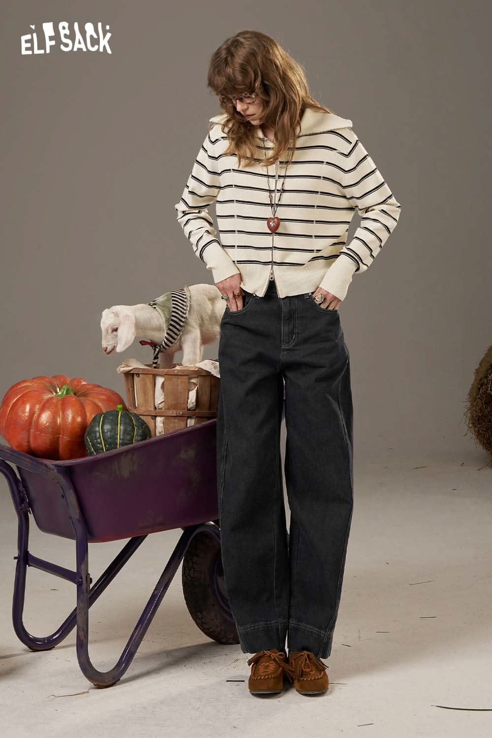 ELFSACK women's denim straight leg pants styled with a striped sweater in a casual setting