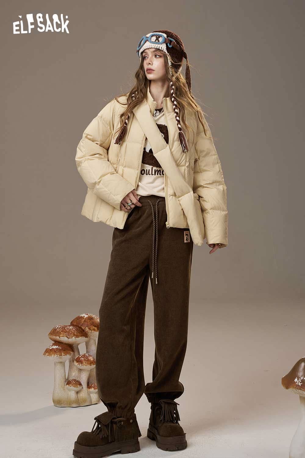 Stylish ELFSACK women's drawstring waist pants in brown, paired with a cream puffer jacket and accessories