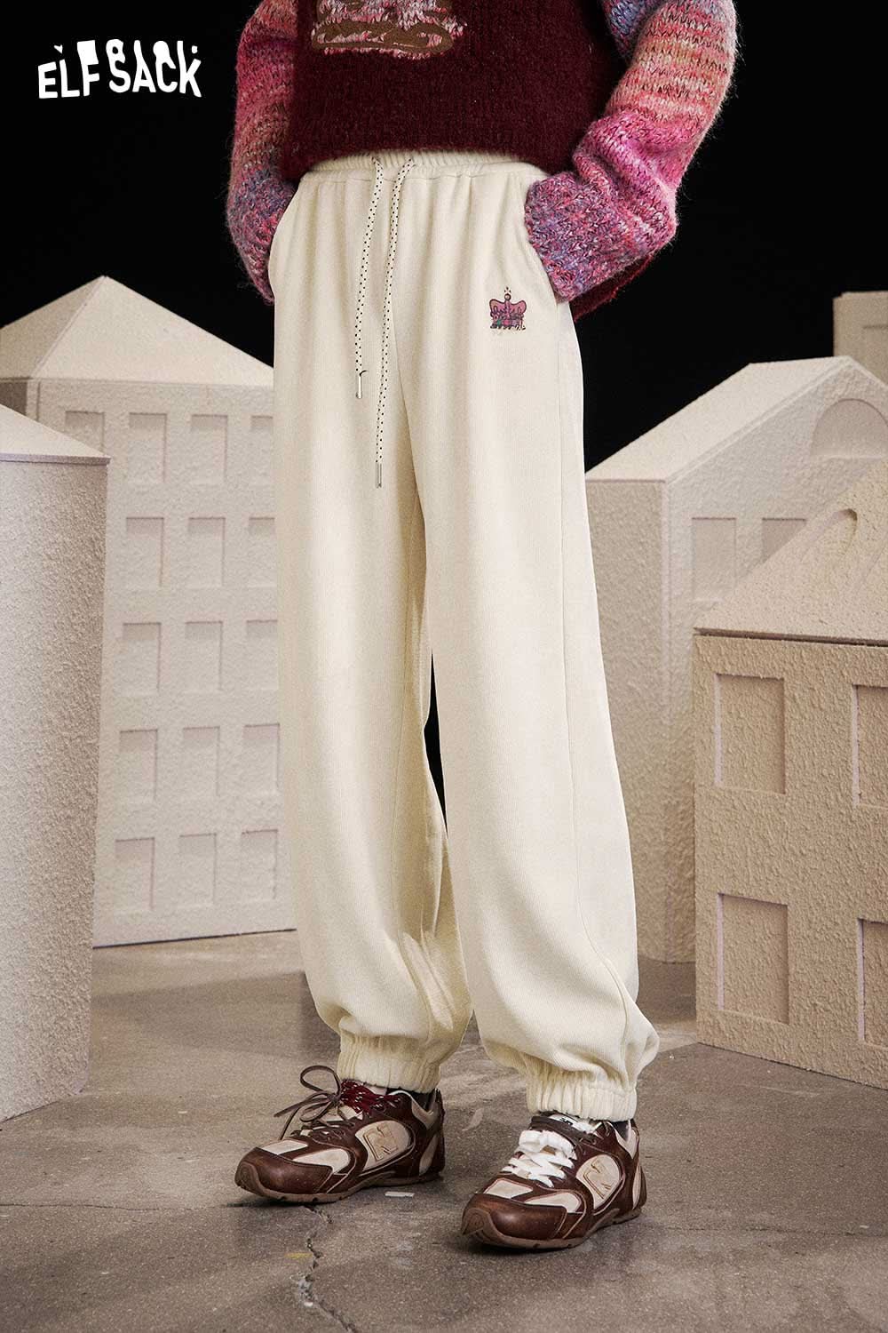 ELFSACK women's drawstring waist pants in cream color with elastic cuffs and logo design
