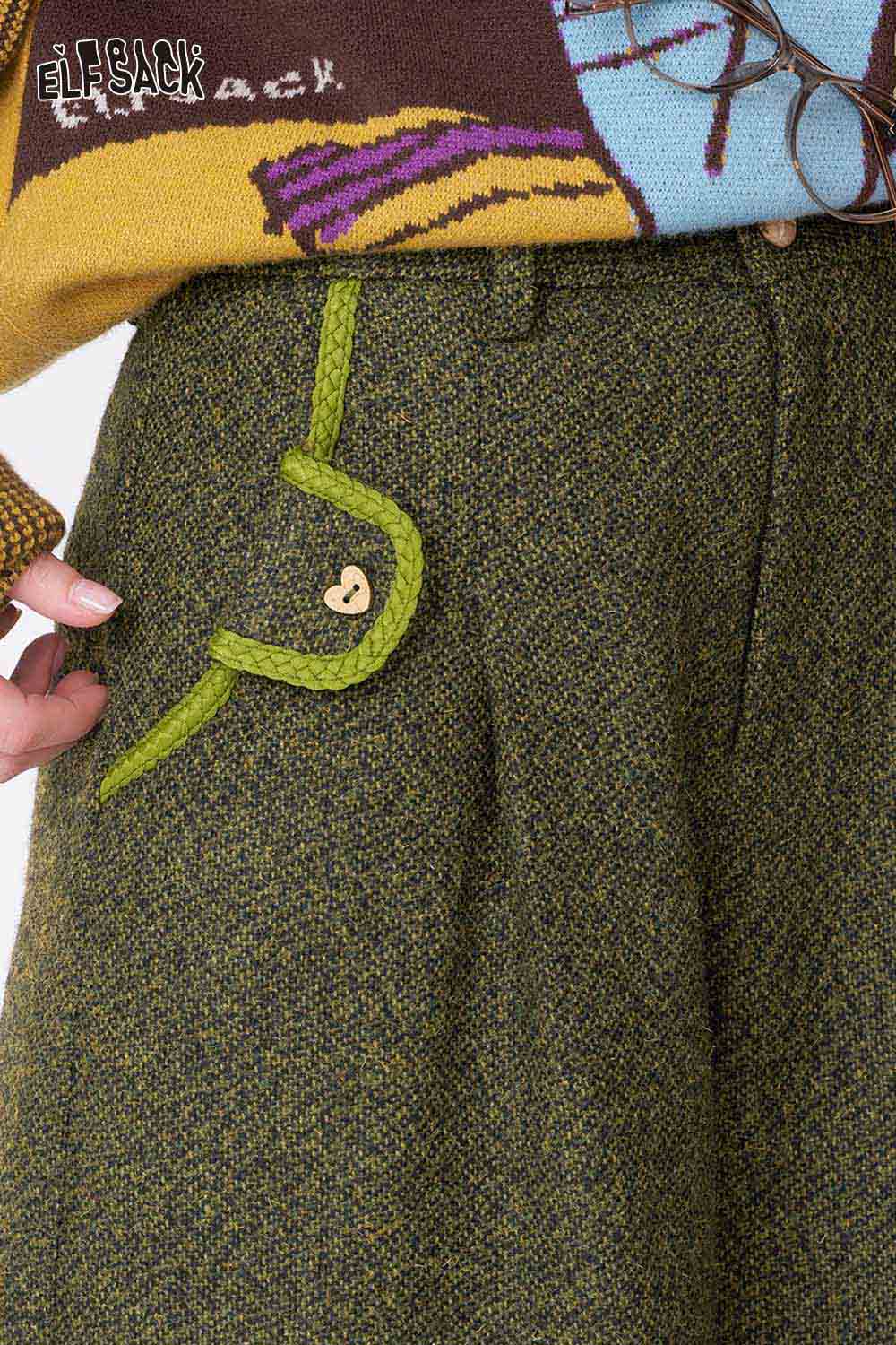 ELFSACK women's empire waist bermuda shorts featuring a unique pocket design and textured fabric