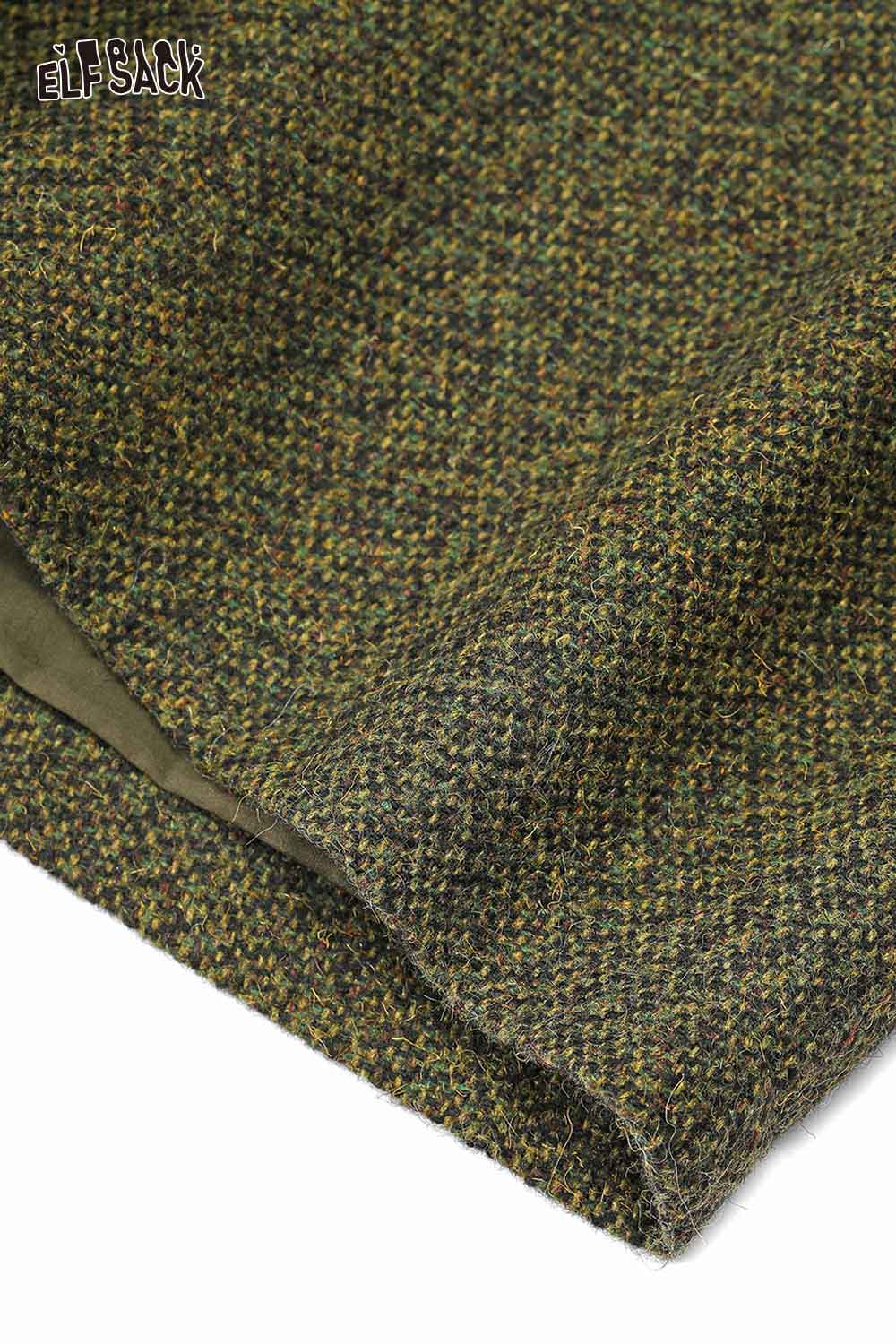 Close-up of fabric texture for ELFSACK women's empire waist bermuda shorts in a green pattern