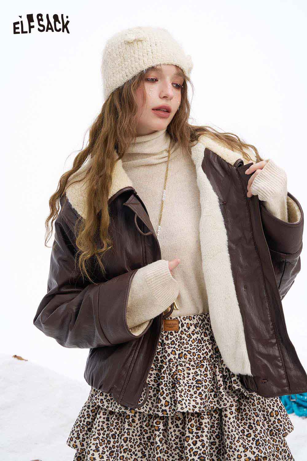 Women's faux leather jacket with plush collar from ELFSACK, styled with a cozy sweater and trendy skirt