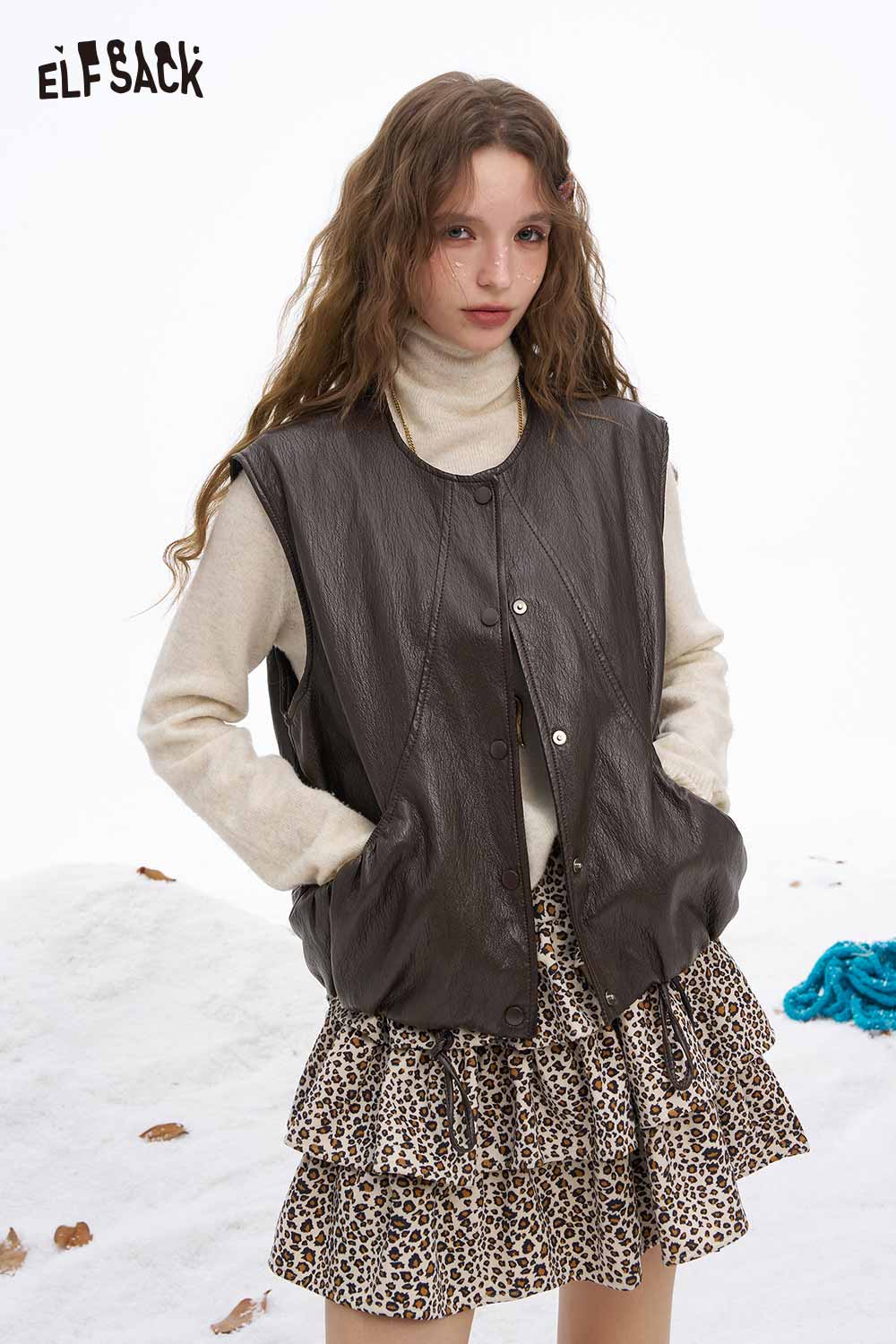 ELFSACK women's faux leather sleeveless jacket paired with a stylish sweater and leopard print skirt