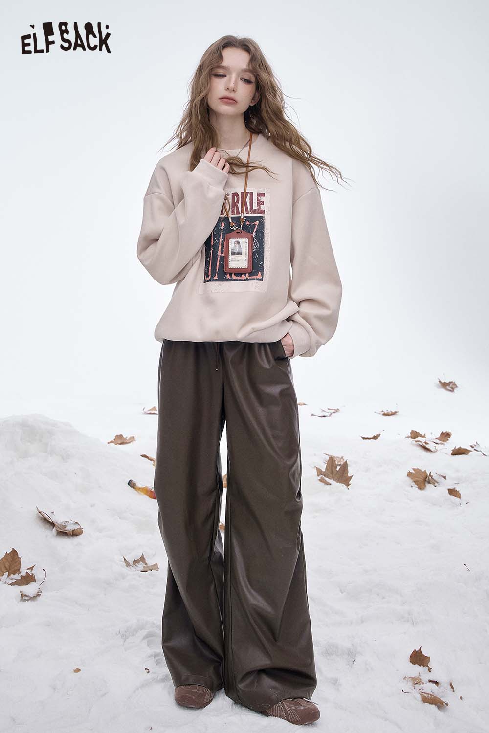 ELFSACK women's faux leather straight leg pants paired with a cozy sweatshirt for a stylish winter look