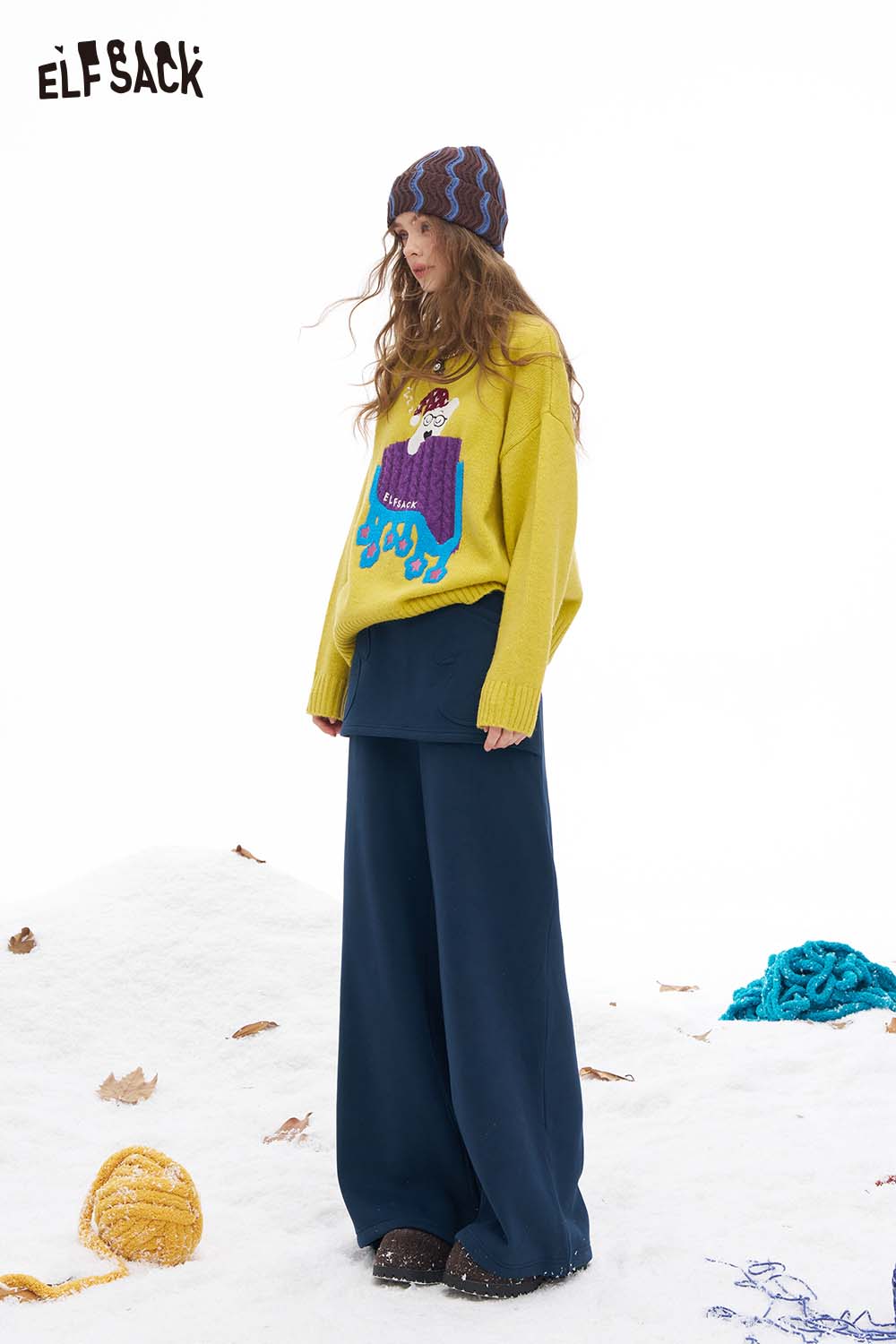 ELFSACK women's floor length wide leg pants paired with a colorful sweater for a stylish winter look