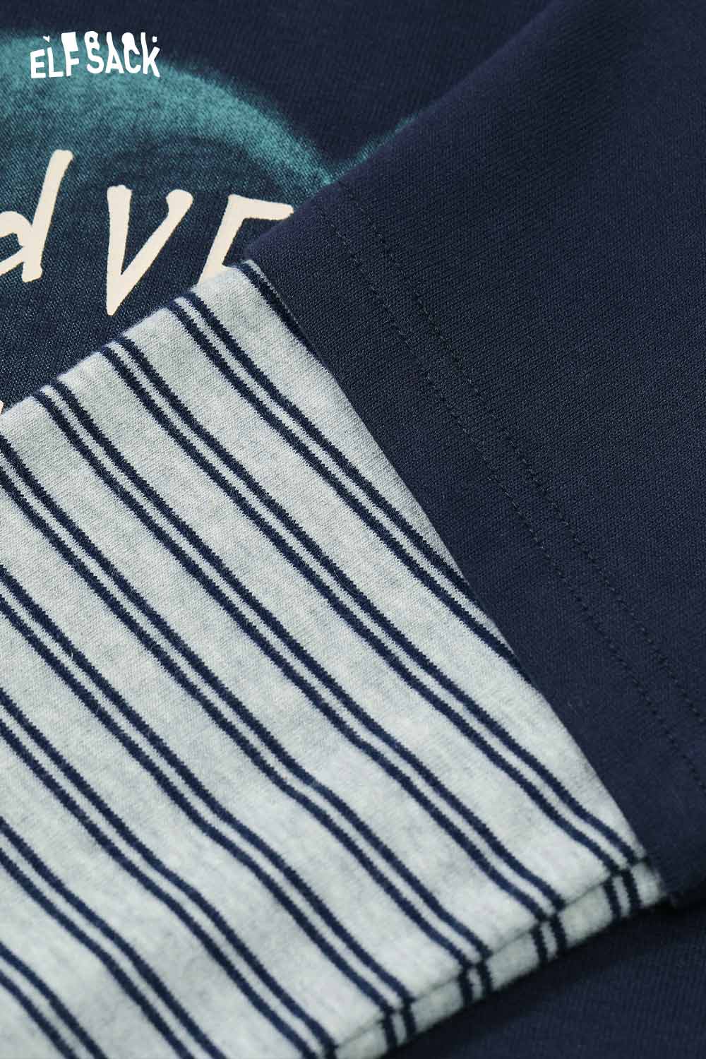 Close-up of ELFSACK women's graphic embroidered long sleeve tshirt featuring striped sleeves