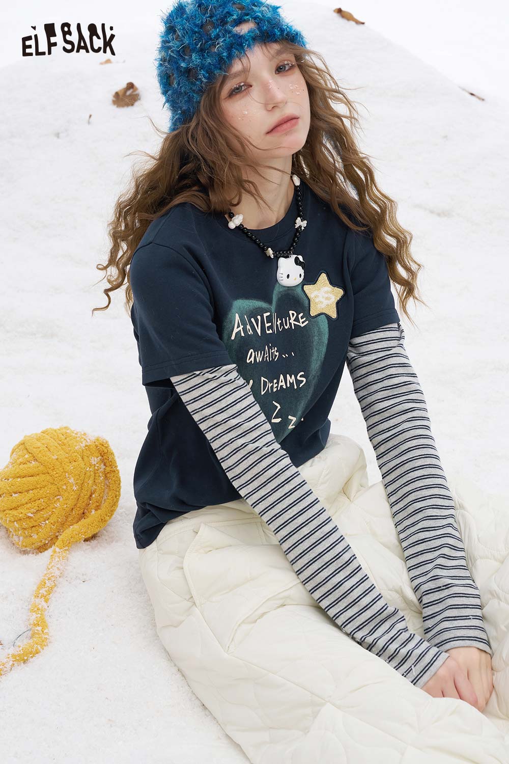 ELFSACK women's graphic embroidered long sleeve tshirt with striped sleeves for a cozy winter look