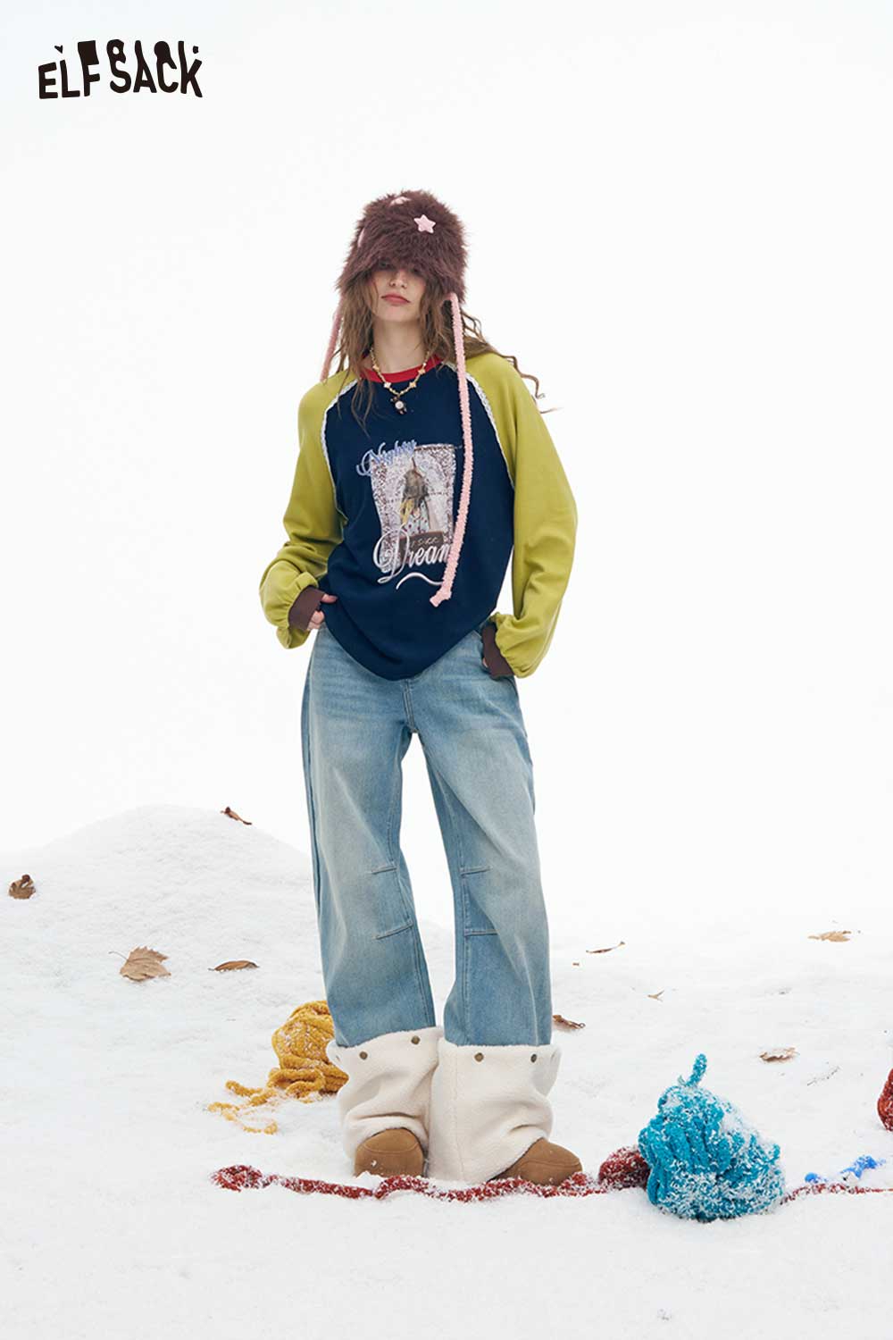 ELFSACK women's graphic letter tshirt styled with casual blue jeans and winter boots in a snowy setting