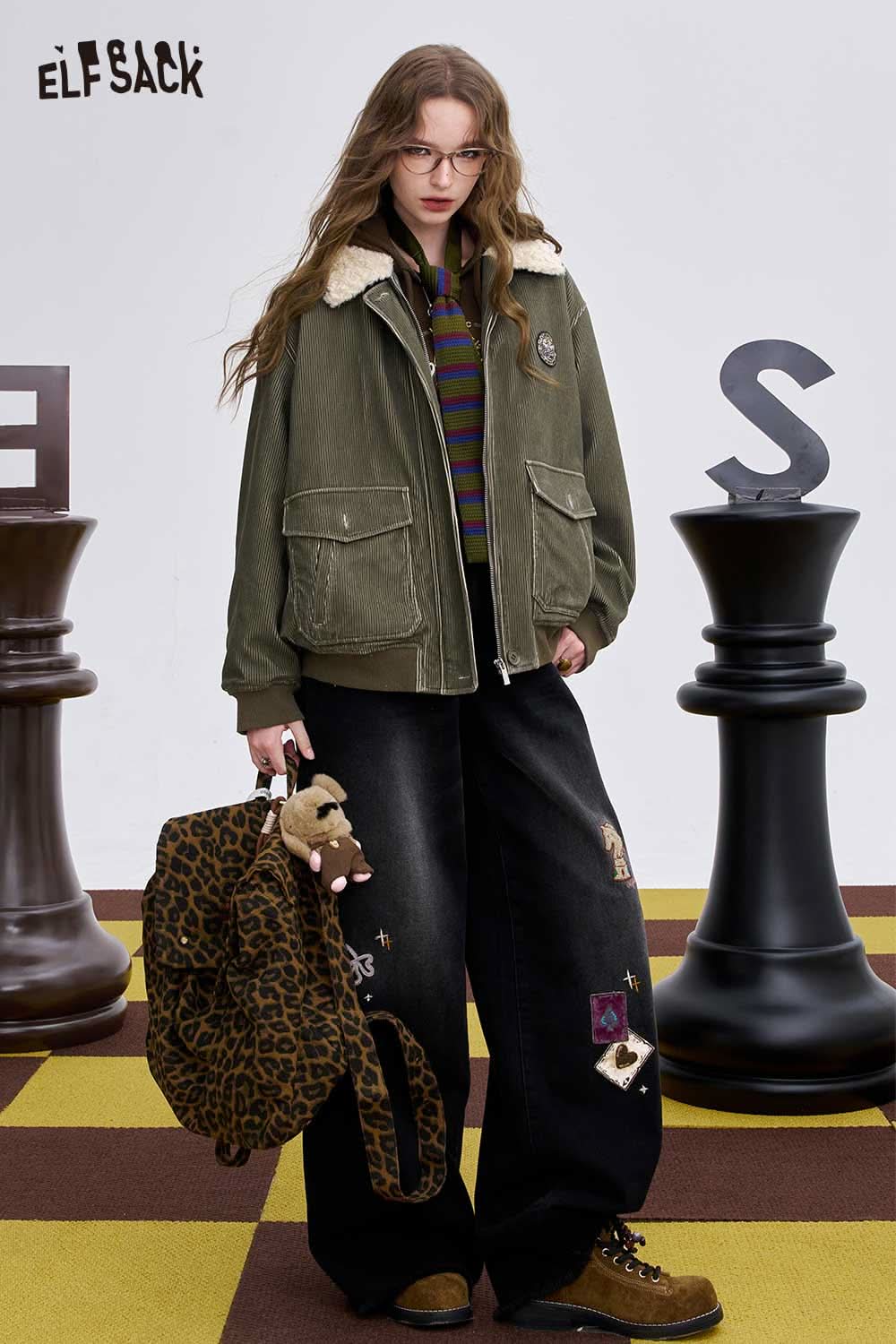 ELFSACK women's graphic long sleeve tshirt styled with a cozy jacket and bag for a trendy look