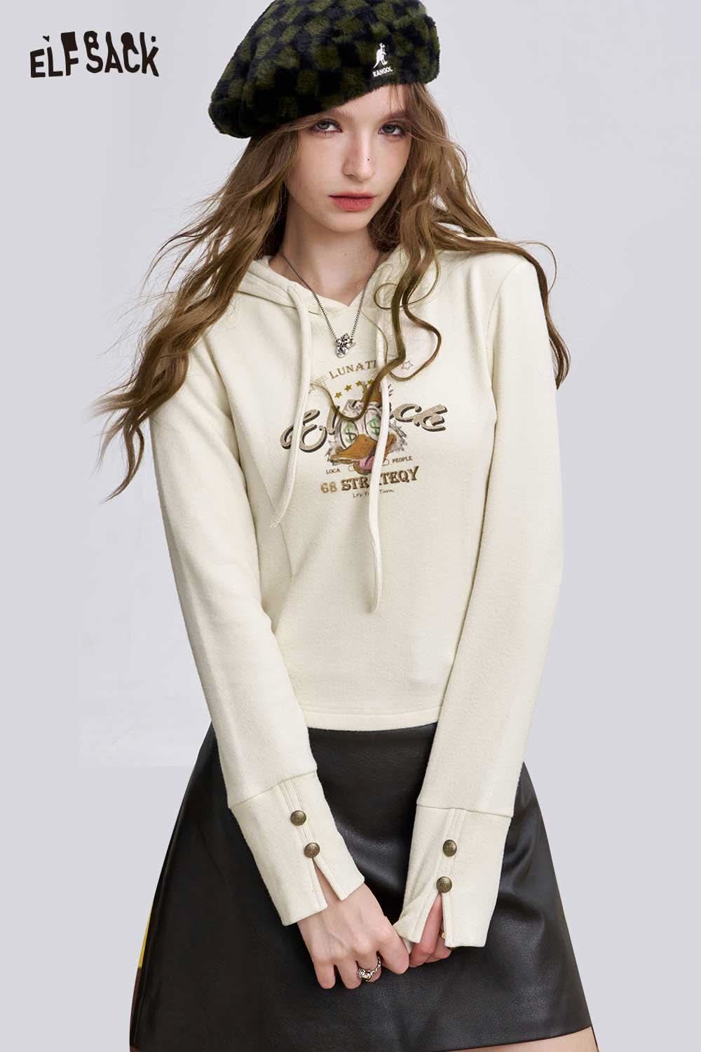 ELFSACK women's graphic long sleeve tshirt in cream with a stylish logo design and relaxed fit