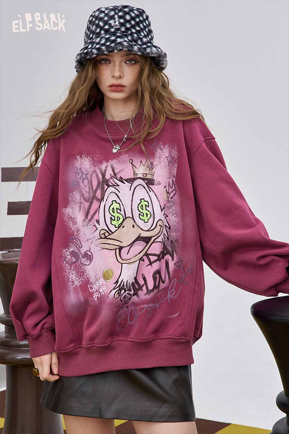 ELFSACK women's graphic long sleeve t-shirt in maroon with playful graffiti art and oversized fit