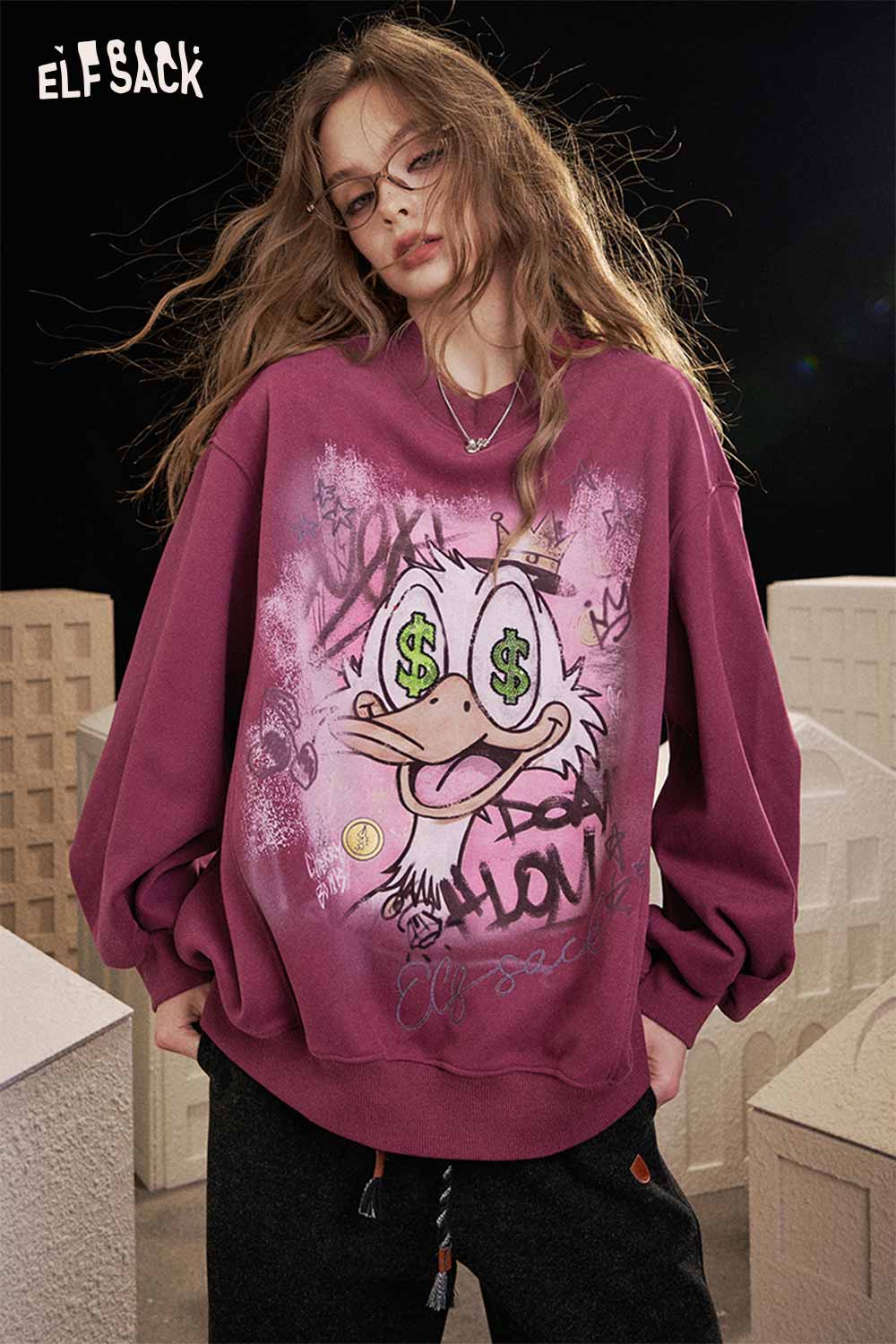 ELFSACK women's graphic long sleeve tshirt in maroon with playful cartoon design