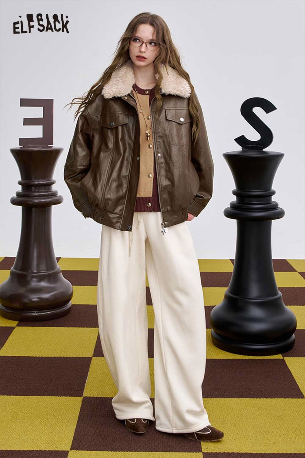 ELFSACK women's graphic plush leather jacket in brown with cozy fur collar styled on a model