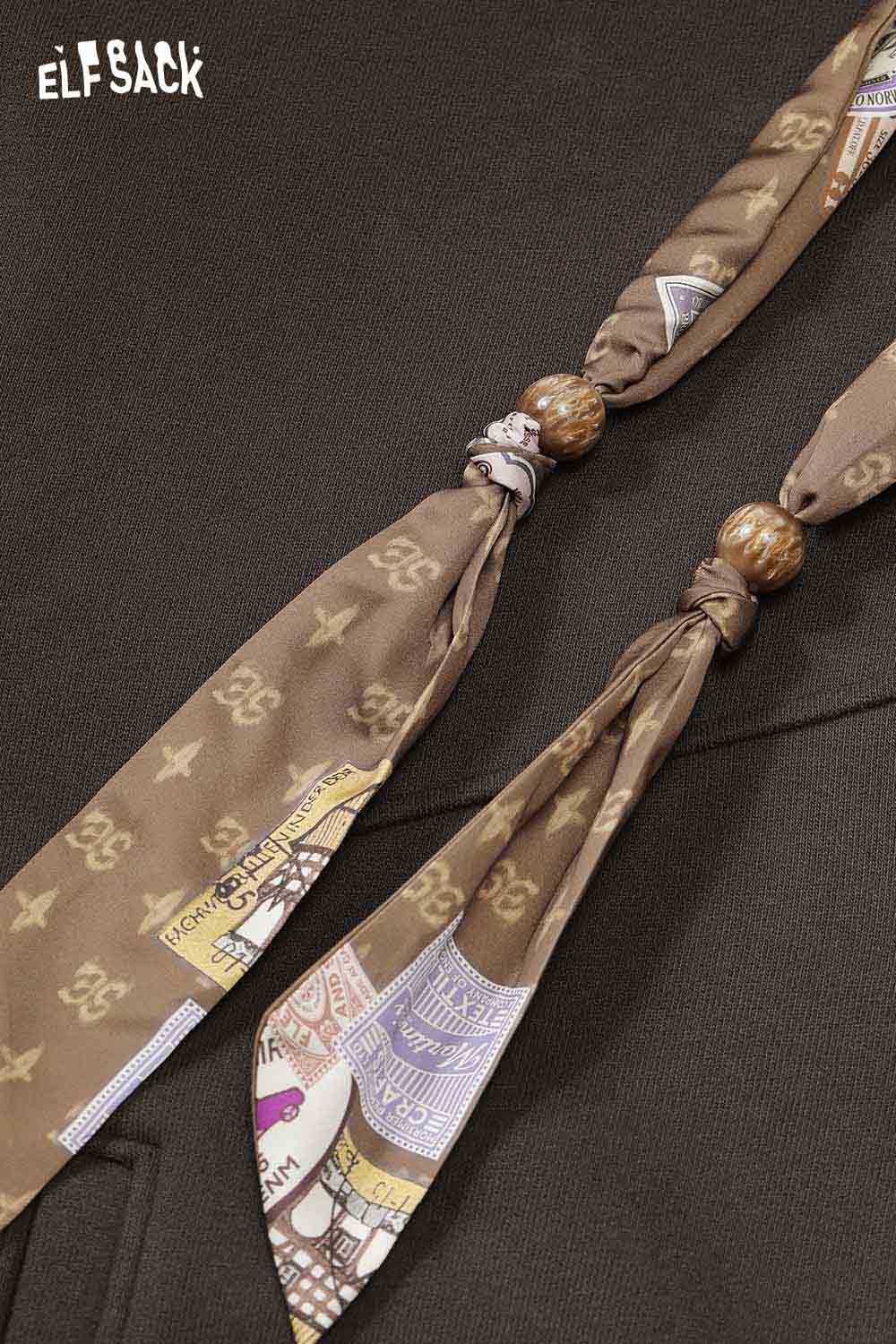 ELFSACK women's graphic print hoodie featuring unique decorative ties and a stylish design