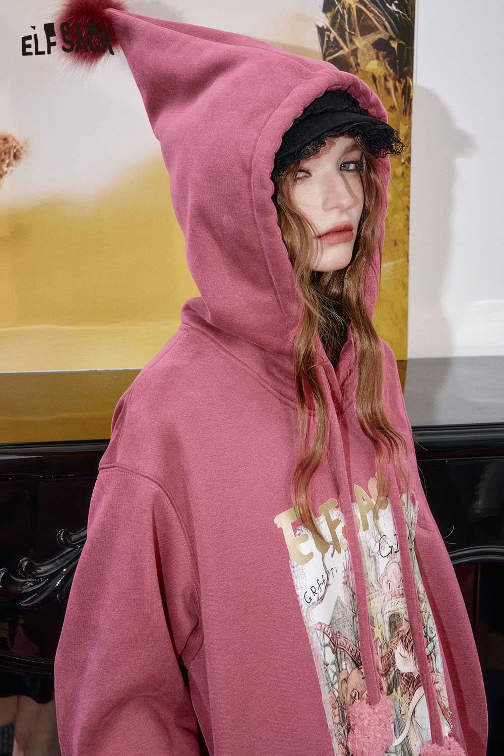 ELFSACK women's graphic print hoodie in pink with unique design and playful hood for trendy looks