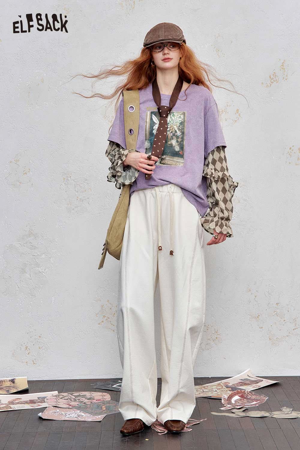 Trendy women's graphic print layered tee by ELFSACK, featuring a unique design and relaxed fit