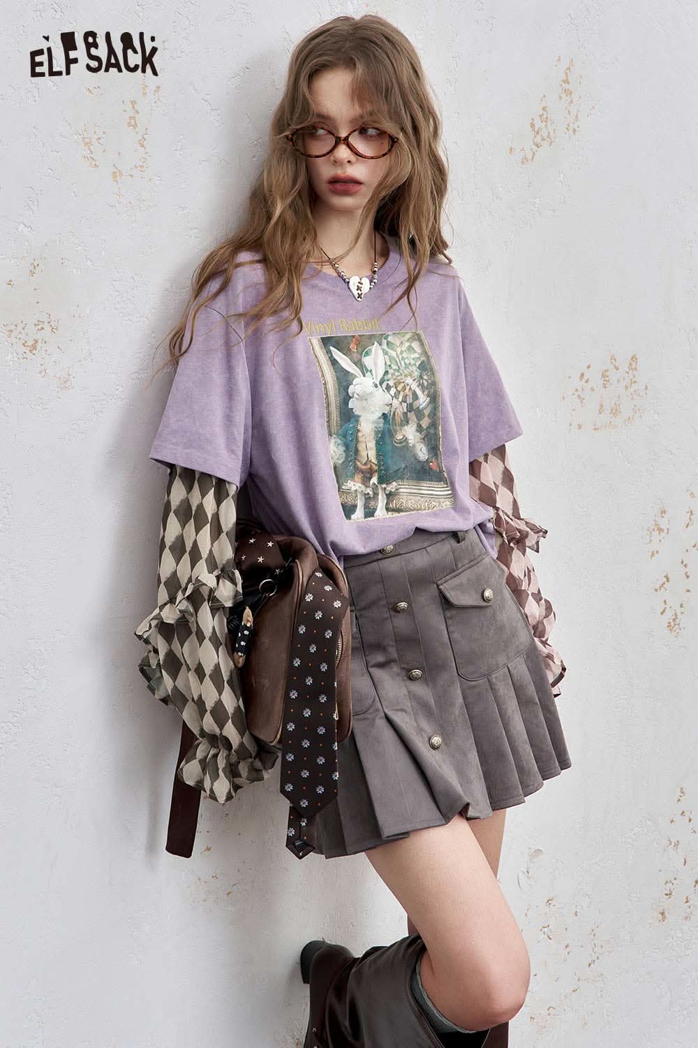 ELFSACK women's graphic print layered tee with a unique artwork design paired with a stylish skirt