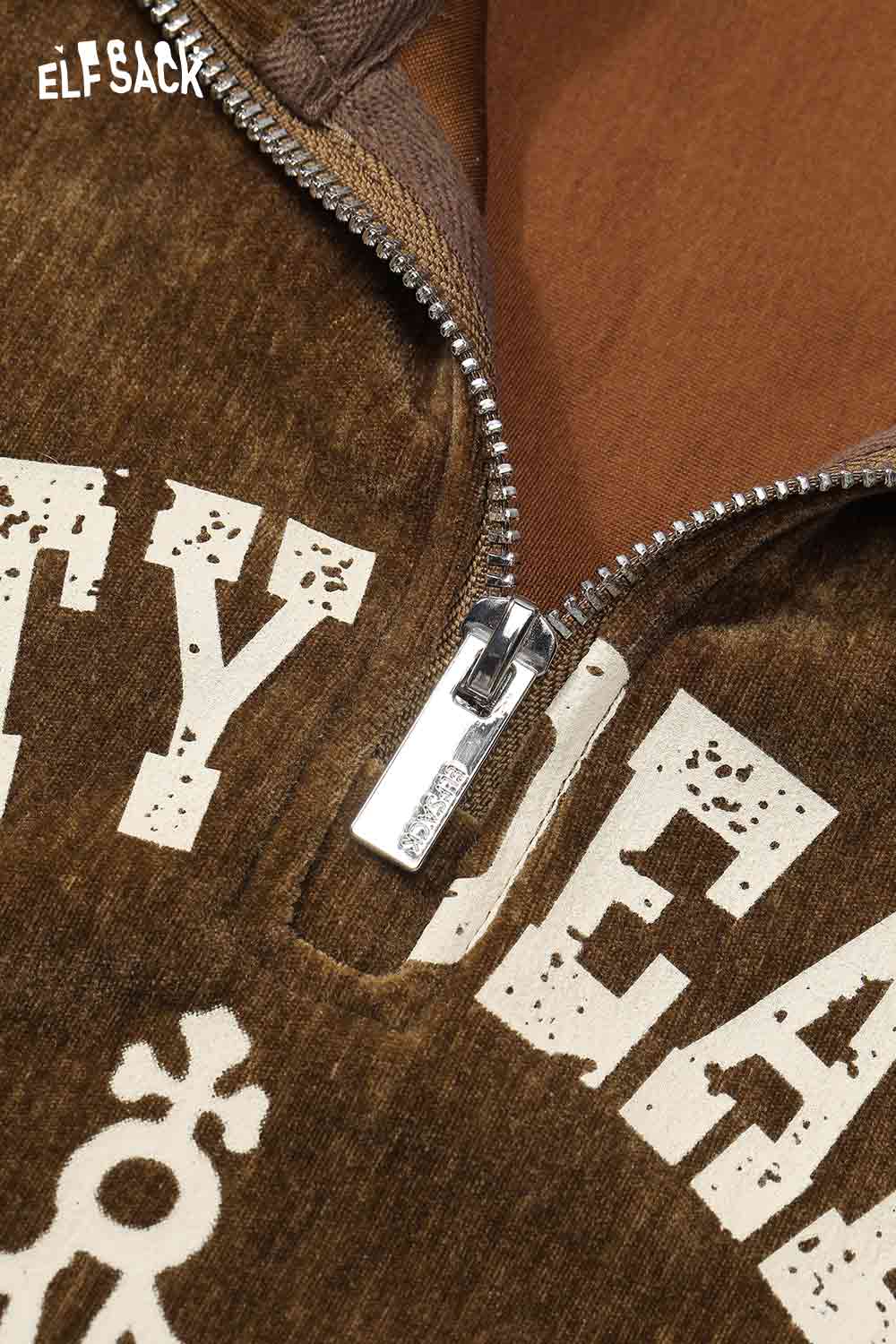 Close-up of ELFSACK women's graphic sweatshirt and skirt set featuring a zippered neckline and unique design