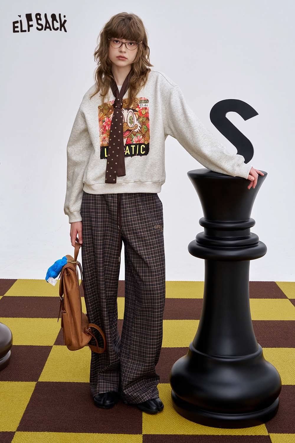 ELFSACK women's graphic sweatshirt featuring a colorful print and relaxed fit for stylish layering