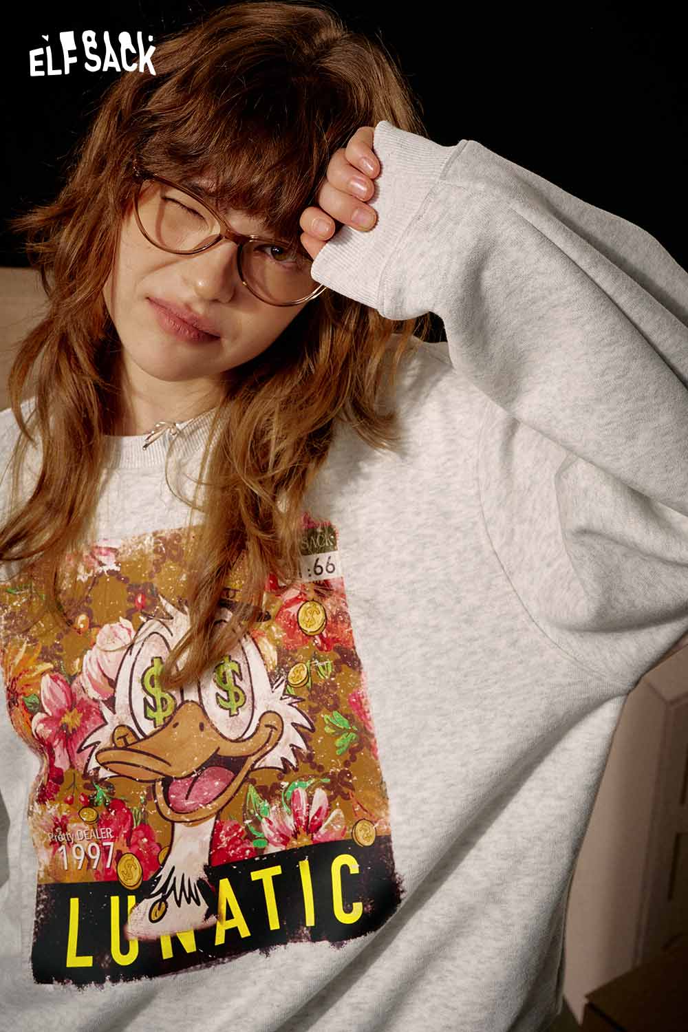 ELFSACK women's graphic sweatshirt featuring a fun cartoon print and relaxed fit for casual wear