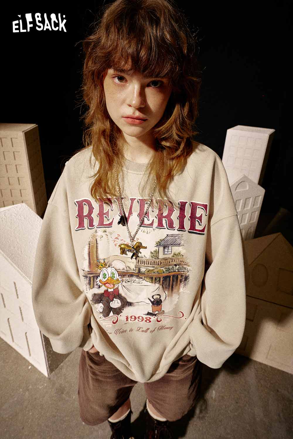 ELFSACK women's graphic sweatshirt featuring colorful artwork and relaxed fit design