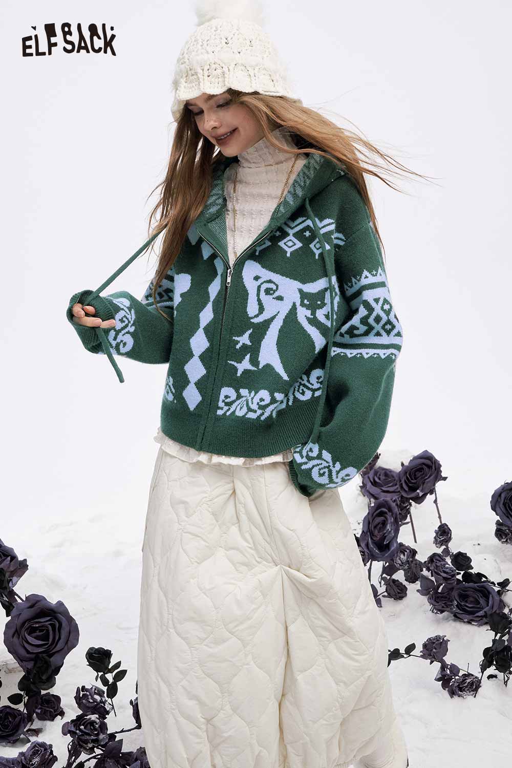 ELFSACK women's graphic zip up hoodie in green with unique patterns, layered over a cozy outfit