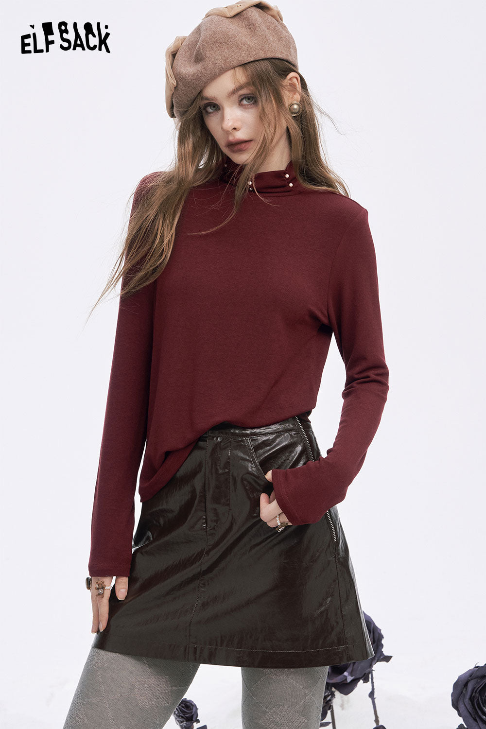 ELFSACK women's high neck pearl t-shirt in burgundy paired with a shiny black skirt for a stylish look