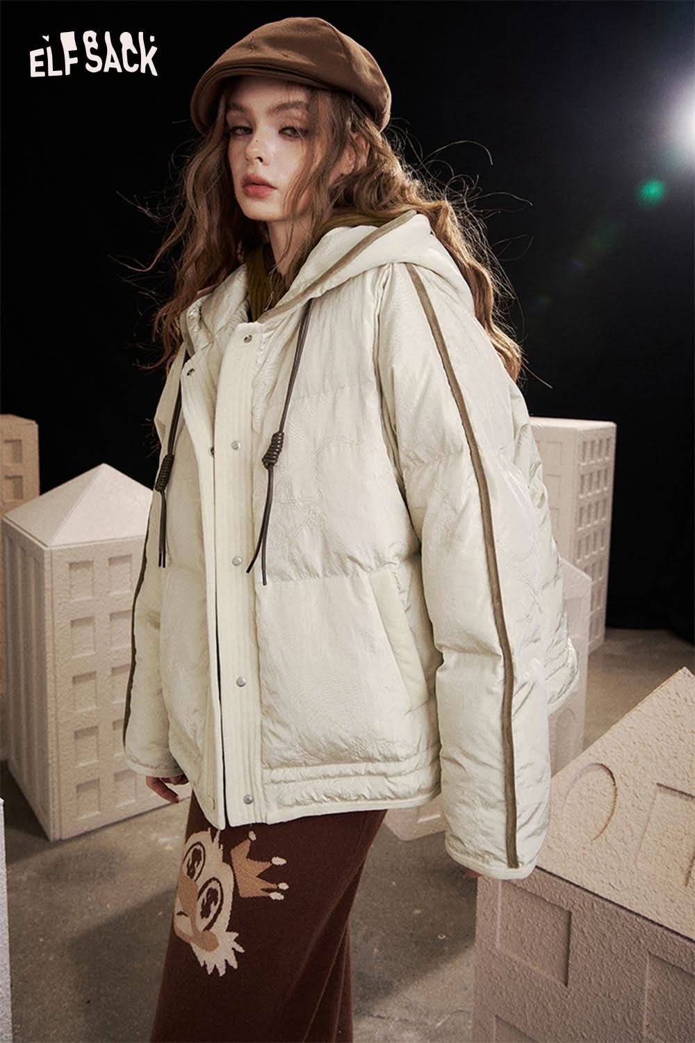 ELFSACK women's hooded down jacket in light cream color with a stylish oversized fit for chilly weather